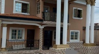 Six (6) Bedroom (all in suite) Duplex with two mini sitting room upstairs and central sitting room+Dinning downstairs, with two bedroom apartment behind but attached to the main building as Guest Rooms with a large and interlocked compound for sale